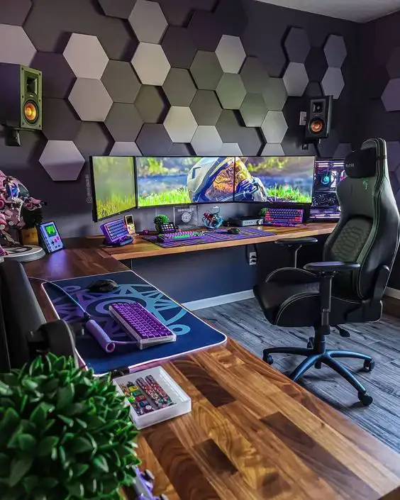 Large gaming room with a gaming chair and a long desk with multiple monitors
