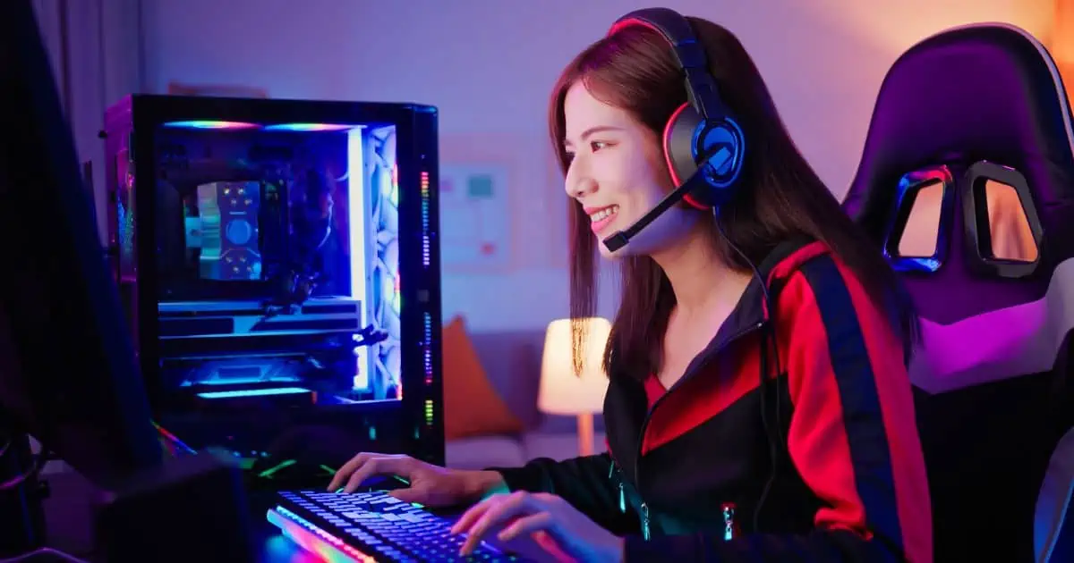 a woman with gaming headsets on her head playing video games 