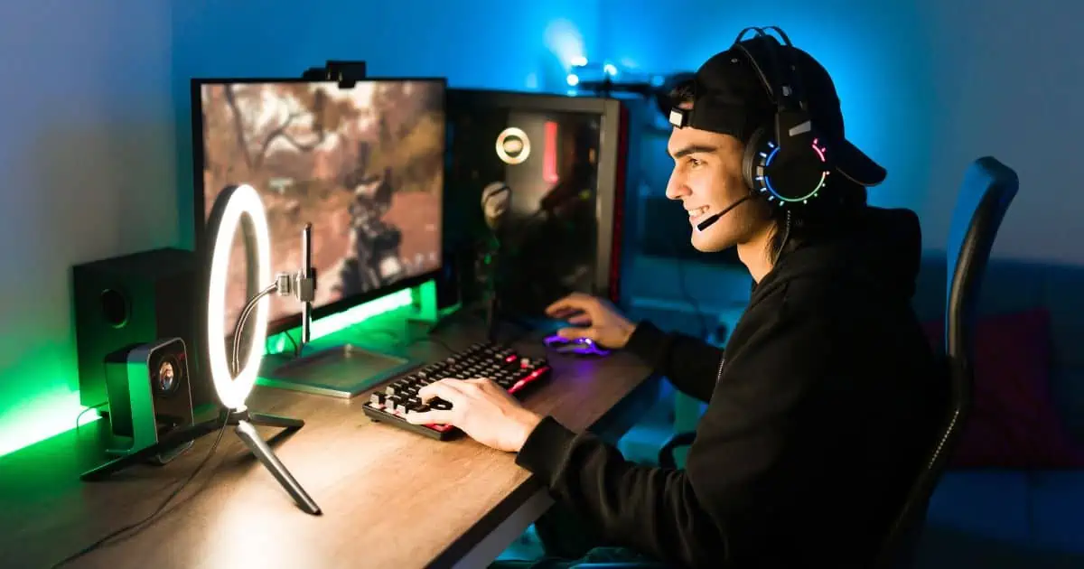 a man smiling  live streaming himself playing games